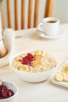 Oatmeal with strawberry jam, peanut butter, banana, Chia photo