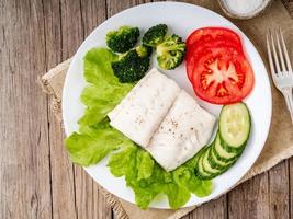 Steamed cod fish. Paleo, keto, fodmap healthy diet with photo