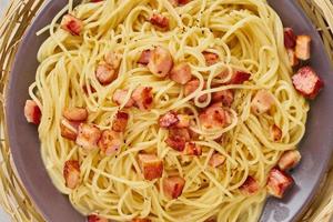 Close up carbonara pasta. Spaghetti with bacon, egg, parmesan cheese photo