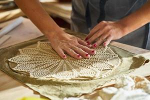 Woman freelance, business, hobby. Woman making ceramic pottery photo