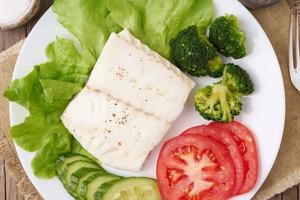 Steamed cod fish. Paleo, keto, fodmap healthy diet with vegetables photo