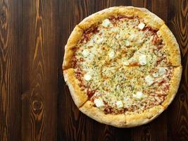 Four cheese pizza with Dor-blue, Parmesan, feta, oregano, mozzarella, tomato sauce,