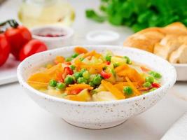 Vegetable soup, bright spring vegetarian dish.