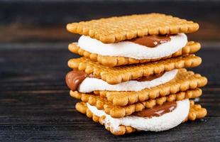 Smores, marshmallow sandwiches - traditional American sweet chocolate cookies photo