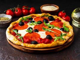 hot homemade Italian pizza margherita with mozzarella and tomatoes