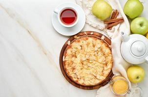 Cheesecake, apple pie, curd dessert with polenta, apples, almond flakes photo