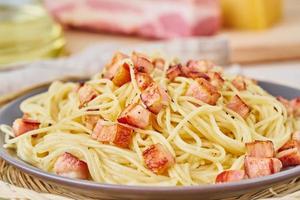 Close up carbonara pasta. Spaghetti with bacon, egg, parmesan cheese photo