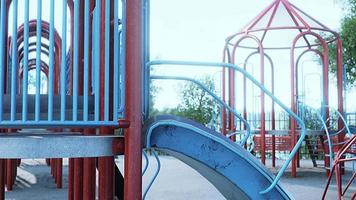 Empty swings on summer kids playground video