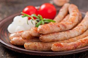 Tasty grilled sausages photo