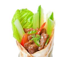 Tortilla wraps with meat and fresh vegetables photo