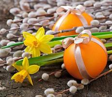 Colorful easter eggs on old wooden background photo