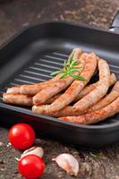 Tasty grilled sausages photo