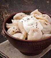 Meat Dumplings - russian boiled pelmeni in plate photo