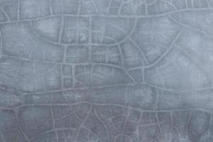 Light gray concrete and lines of crack surface, smooth light gray cement background. photo