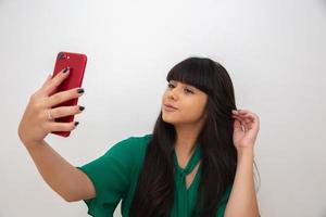 Self portrait of nice, amazing, pretty, positive, sexy woman shooting selfie on front camera photo