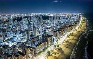 Aerial view of Boa Viagem beach in Recife, capital of Pernambuco, Brazil at night. photo