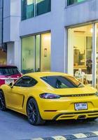 Bangkok, Thailand, 2018-Yellow Porsche parked on street photo