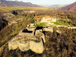 Dmanisi - medieval town with its citadel, public and religious buildings. Archaeological hominin site ruins dated 1.8 million years ago photo