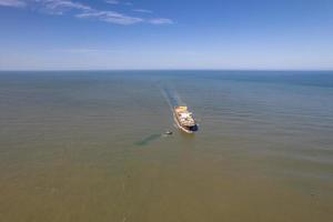 Container Cargo Ship Aerial View, Import Export Business Logistics and International Transport by Container Ship in Open Sea. photo