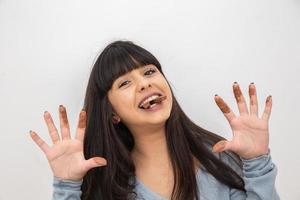 concept - Lovely smiling teenage girl eating chocolate - Imagem photo