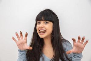 concept - Lovely smiling teenage girl eating chocolate - Imagem photo