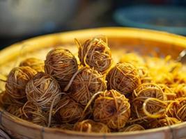 Close-up of deep fried pork ball with noodle. photo