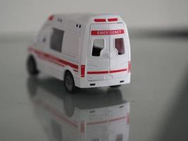 Ambulance Emergency Model white color car on mirror table reflection photo