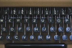 Keyboard of an old retro typewriter with the English alphabet. photo