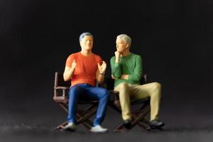 Miniature people Therapist and patient talking together photo