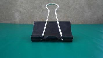 stationery school or office black paperclip photo