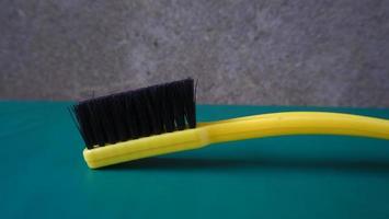 black and yellow shoe brush photo