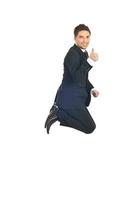 Business man  jump and gives thumbs photo