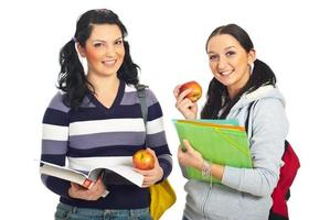 Pretty students females holding apples photo