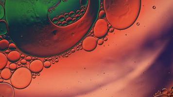 Abstract Colorful Food Oil Drops Bubbles and spheres Flowing on Water Surface, macro Videography video