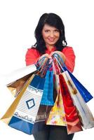 Smiling woman hold many shopping bags photo