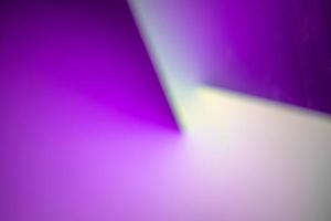 Defocus blurred image of purple and white abstract background. photo