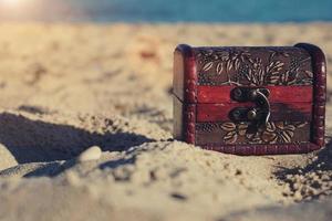 Soft gold shines in an old wooden chest with realistic composition on transparent background with vintage coffer and sparkling particles. photo