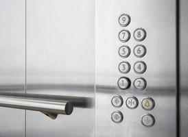 Buttons and handrail in modern elevator business centers photo