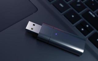 Usb memory stick on laptop. 3d render photo