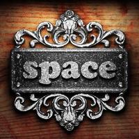 space word of iron on wooden background photo