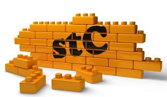 stC word on yellow brick wall photo