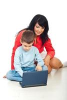 Happy mom and son with notebook photo