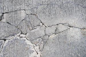 top view of cracks on concrete road photo