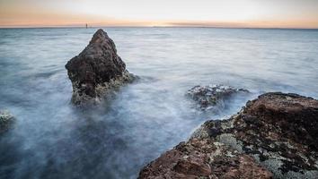 The seascape view of Half moon bay in the Black rock beach during the sunset of Melbourne, Australia. photo