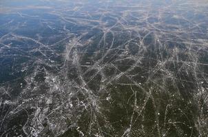 traces of ice skating on lake photo