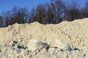 white limestone quarry and blue sky photo