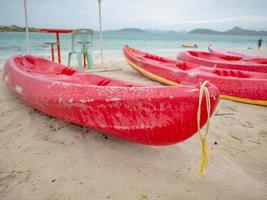 Kayak boat on idyllic beach in vacation time photo