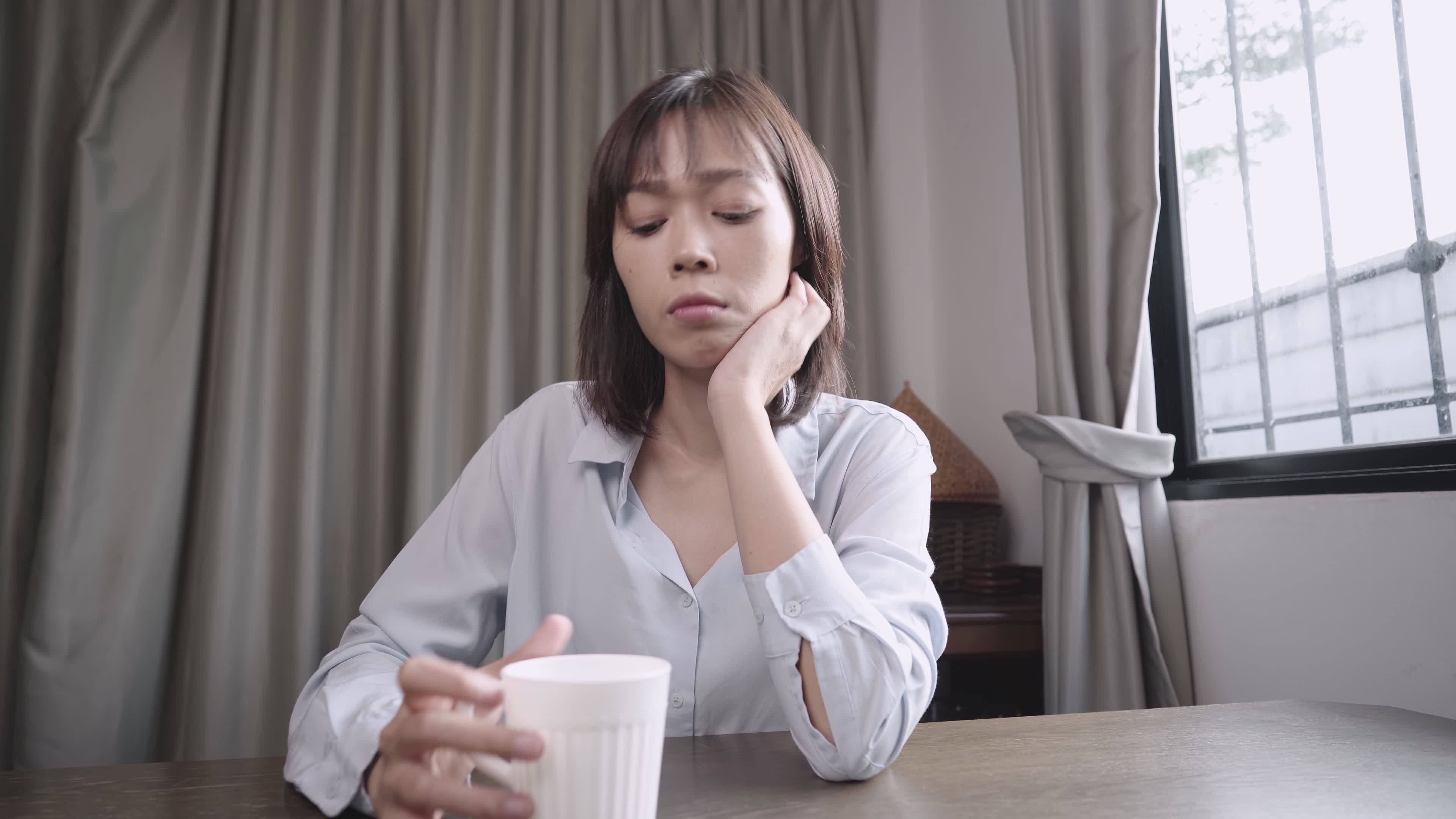 Heart broken Asian woman feel disappointed and unsatisfied, negative feeling lady, sit down