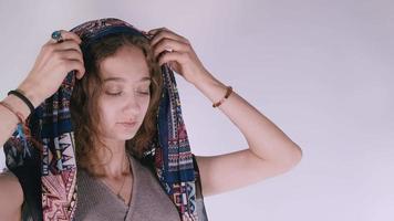 Young girl wears a scarf video