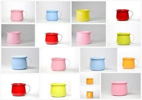 A colorful set of colored zinc mugs or cups. photo